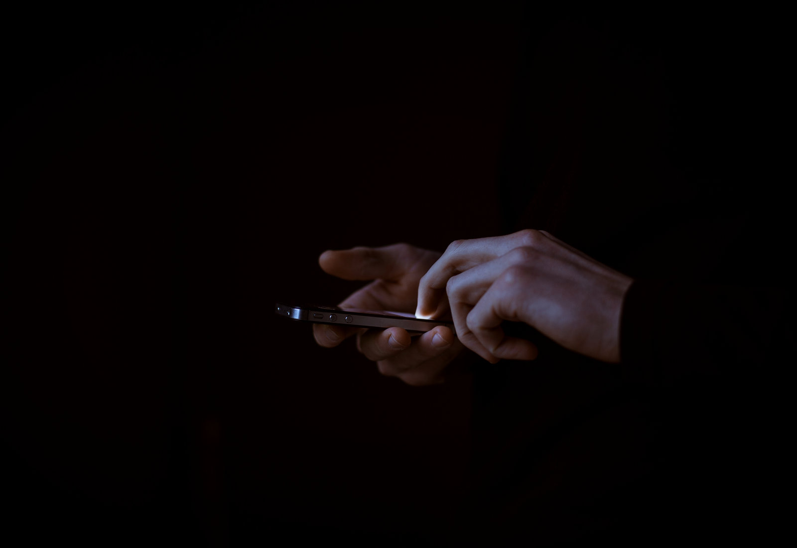 Person typing on a smartphone