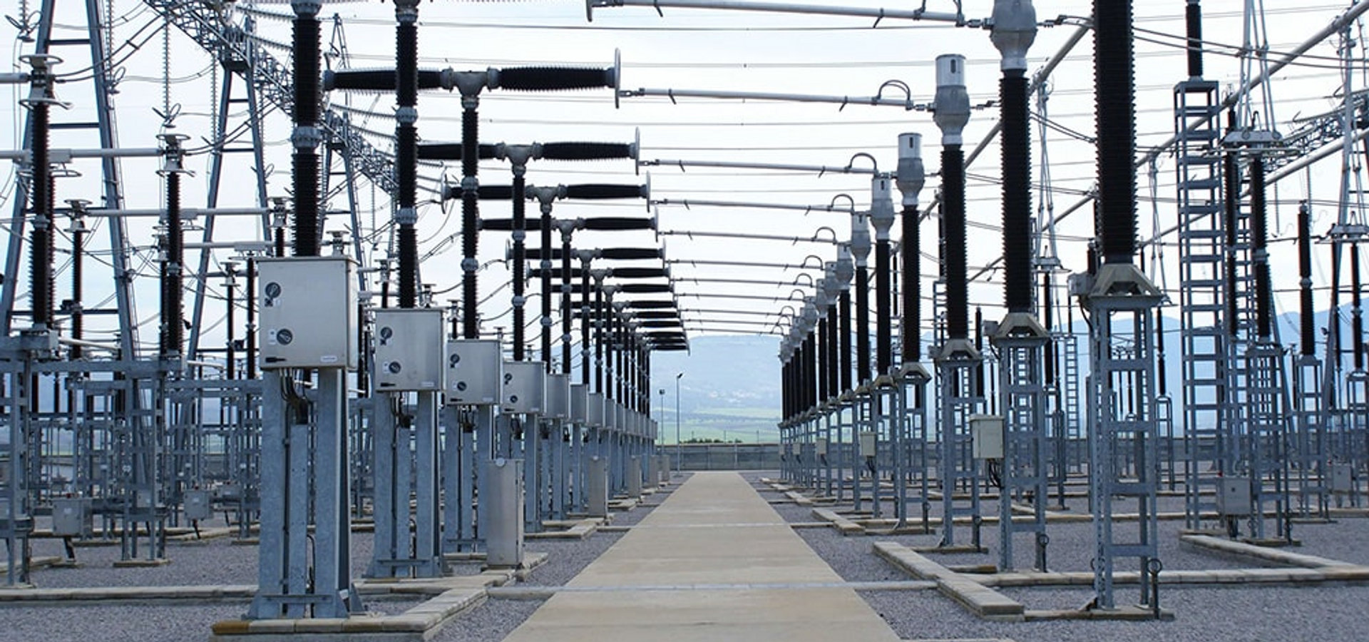 High-voltage power lines at dusk